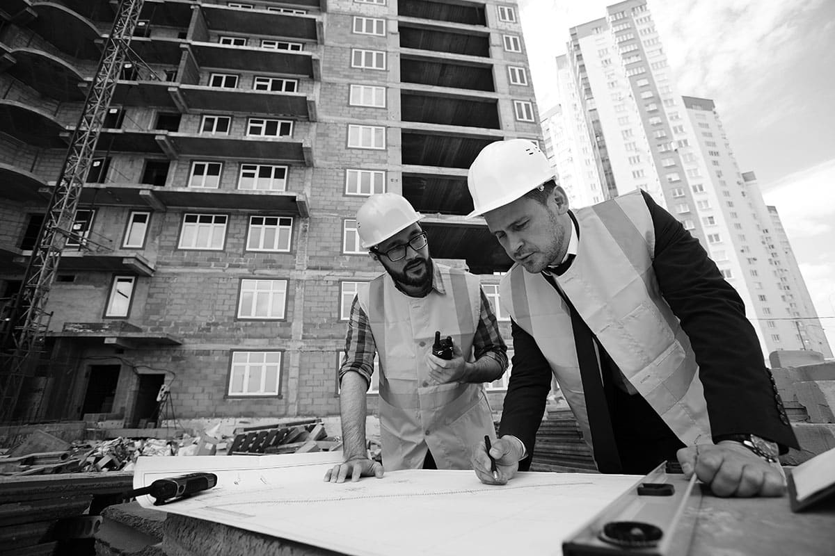 Engineers reviewing structural drawings